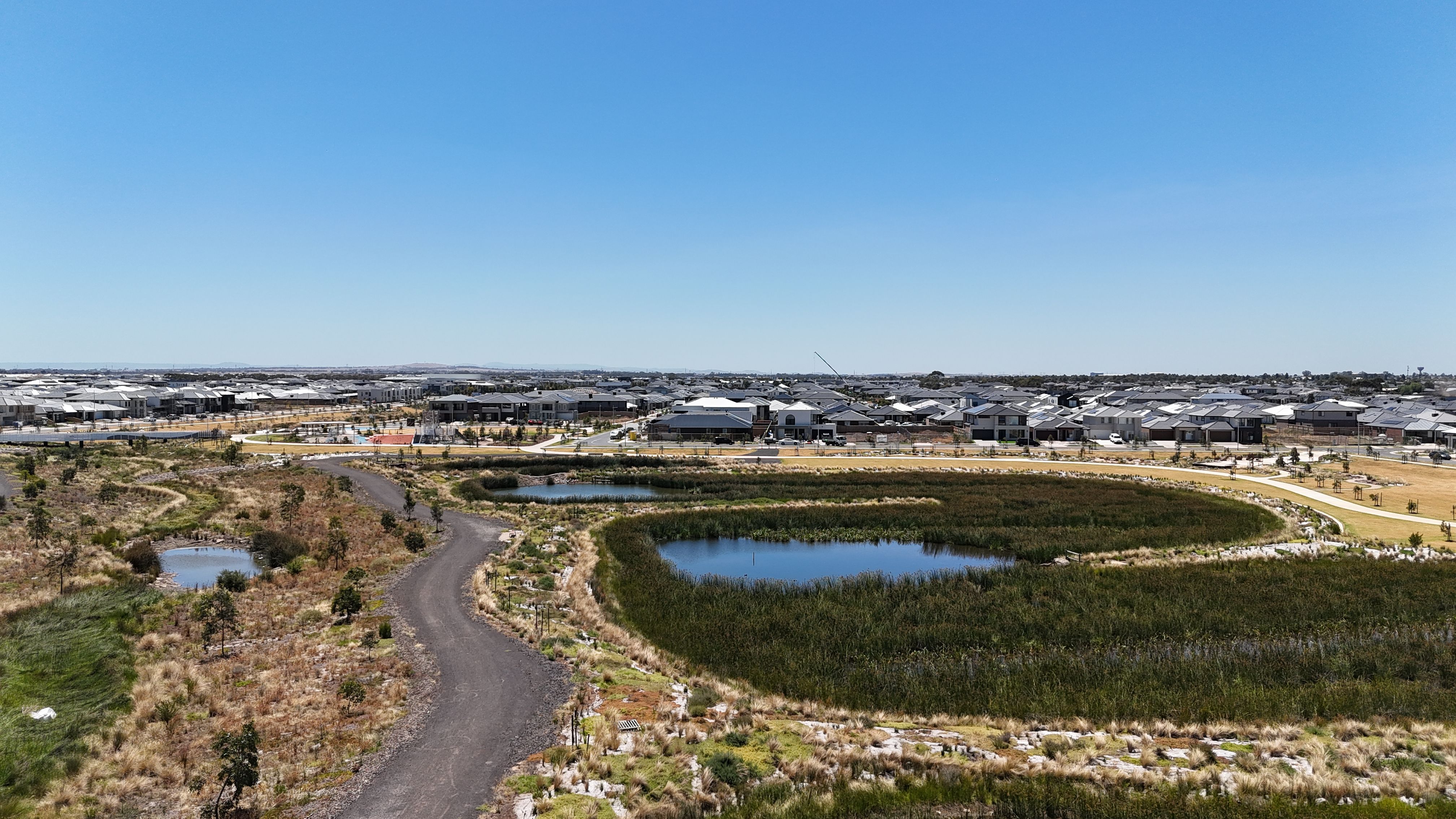 Aerial of an established wetland with pedestrian network in Greater Melbourne